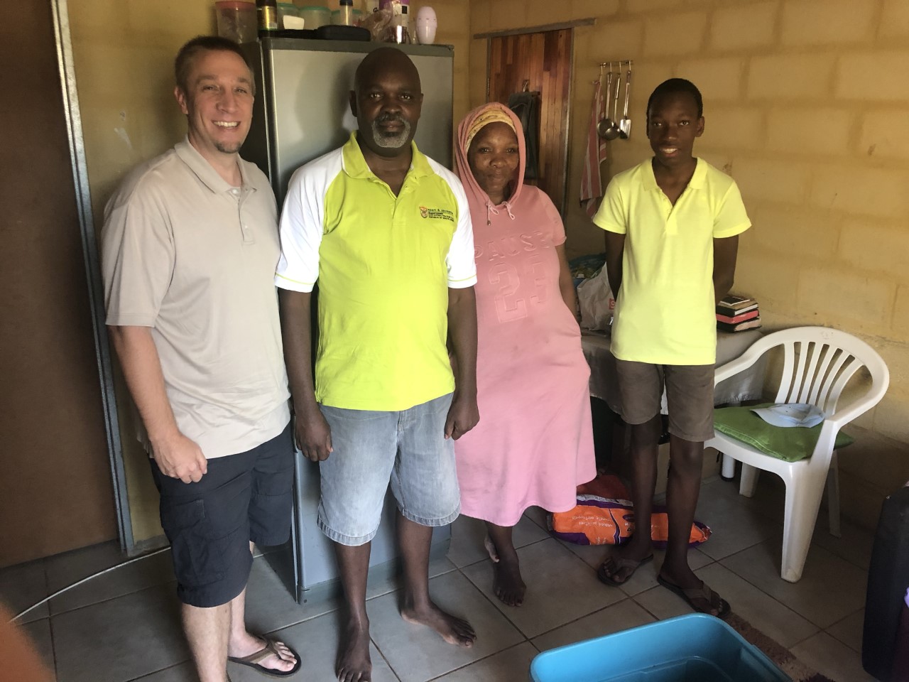 Darin Ishler making a food delivery to a South African family.