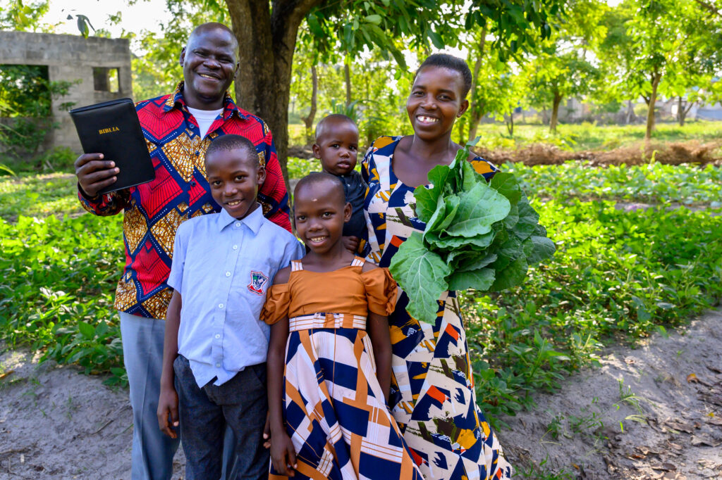 Pastor Samweli Chacha and his family harvest produce from the urban farm they developed next to their home.